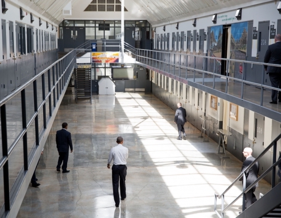 Photo credit: "President Barack Obama walks in the Residential Drug Abuse Prevention Unit at El Reno Prison after making a statement to the press, in El Reno, Okla., July 16, 2015." Official White House Photo by Pete Souza, public domain.