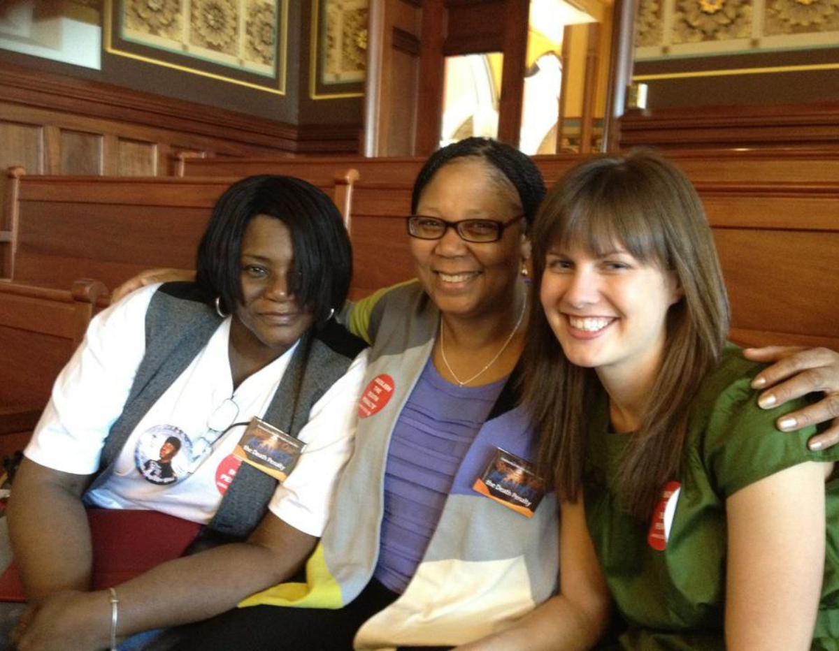 three women sitting next to each other