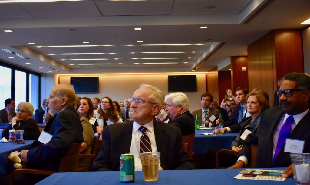 Judge and the rest of the crowd listens to the speakers