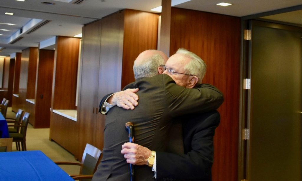 Larry Lustberg shares an embrace with Judge Gibbons